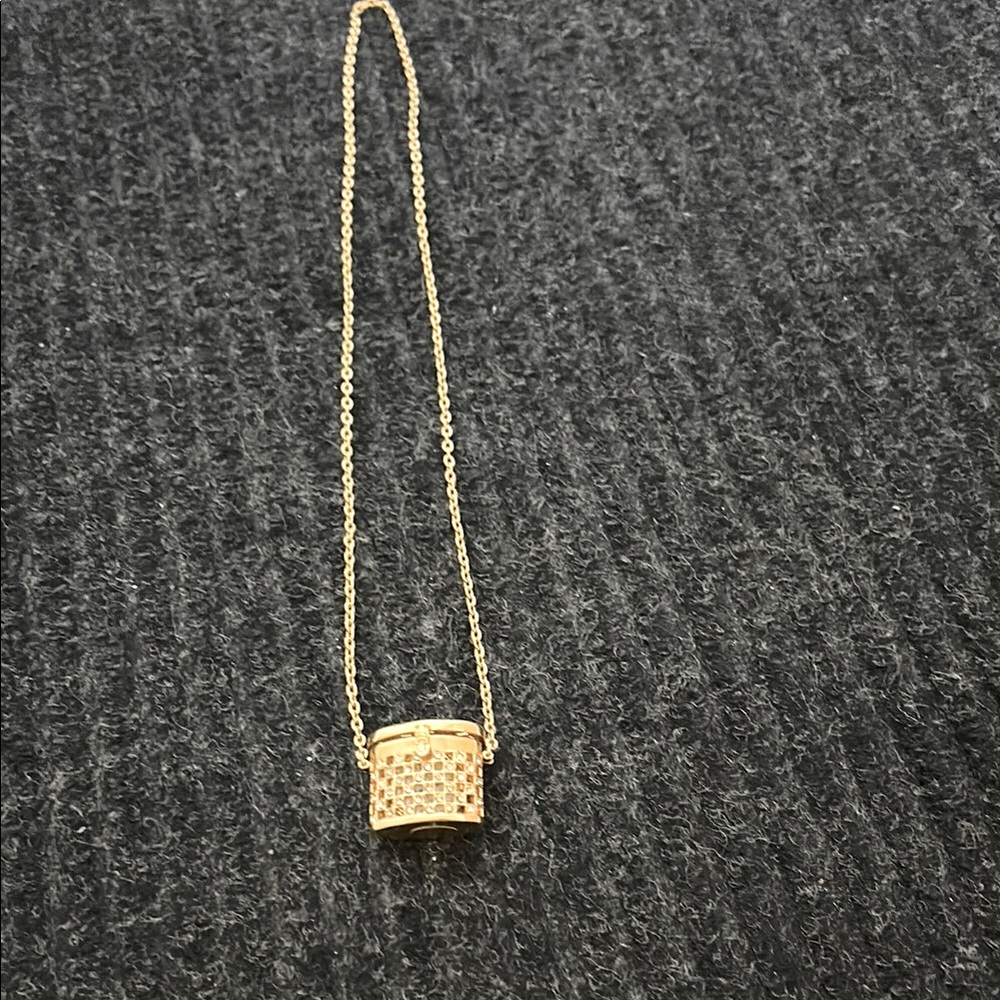 Cute gold tone basket, necklace with watch